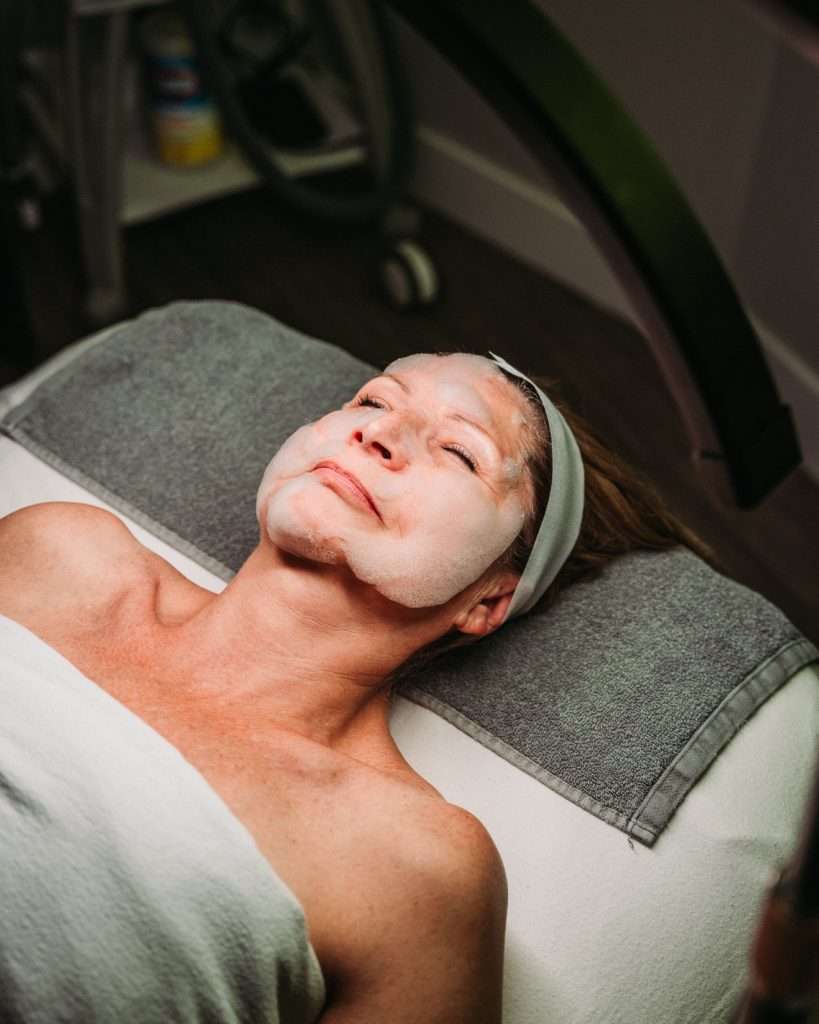 Esthetician performing an O2 Cloud Facial at Ciao Bella Advanced Aesthetics