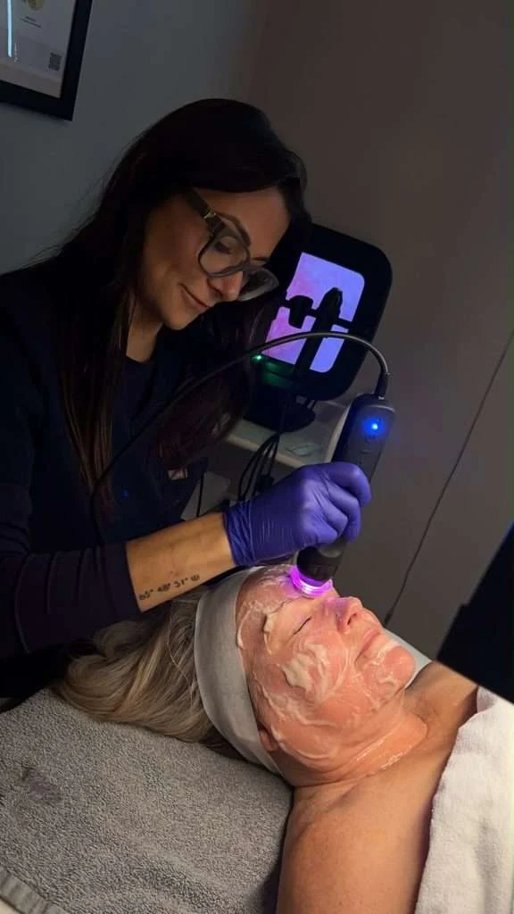 Esthetician performing an OxyGeneo gel mask treatment